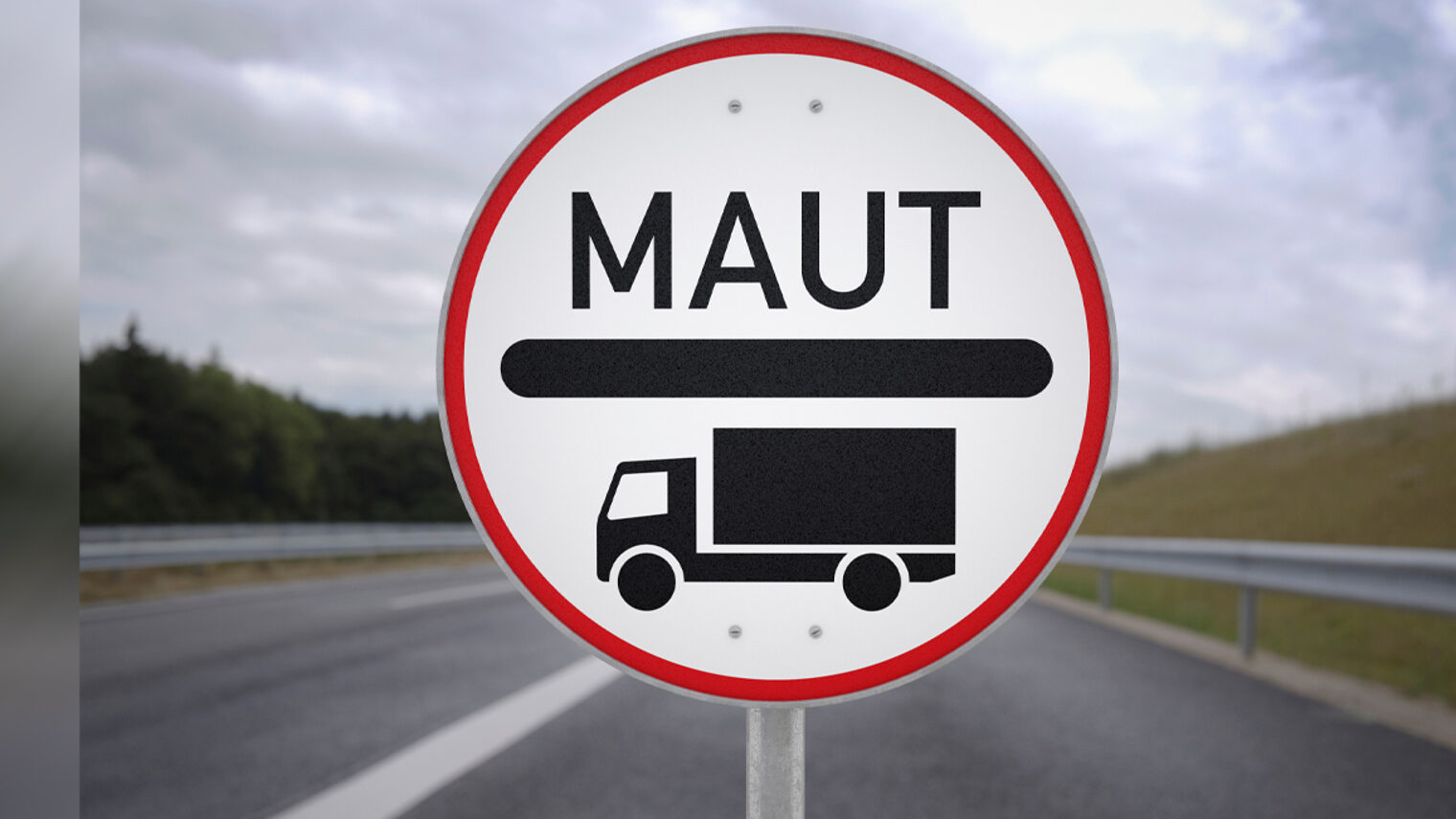 Verkehrsschild für Lkw-Maut vor einer leeren Straße